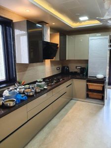 Modern kitchen with stainless steel appliances and sleek cabinetry.