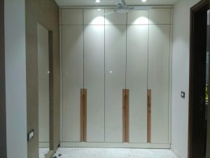 Spacious wooden wardrobe with built-in storage.