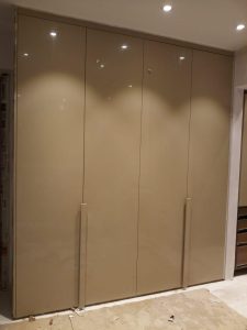 Spacious wooden wardrobe with built-in storage.