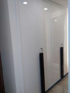 Spacious wooden wardrobe with built-in storage.