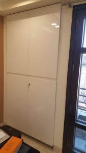 Spacious wooden wardrobe with built-in storage.