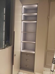 Spacious wooden wardrobe with built-in storage.