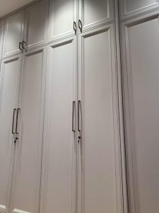 Spacious wooden wardrobe with built-in storage.