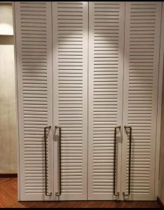 Spacious wooden wardrobe with built-in storage.