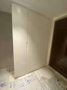 Spacious wooden wardrobe with built-in storage.