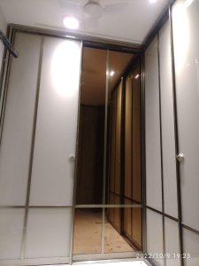 Spacious wooden wardrobe with built-in storage.